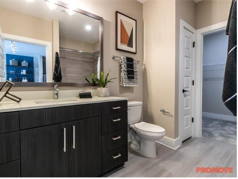 2855 Crescent Parkway, Unit 731 Atlanta, GA 30339 - Photo 5 of 6 a bathroom with a sink toilet and shower