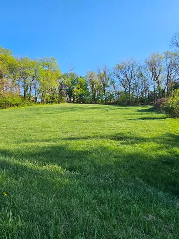 a view of building with outdoor space and trees