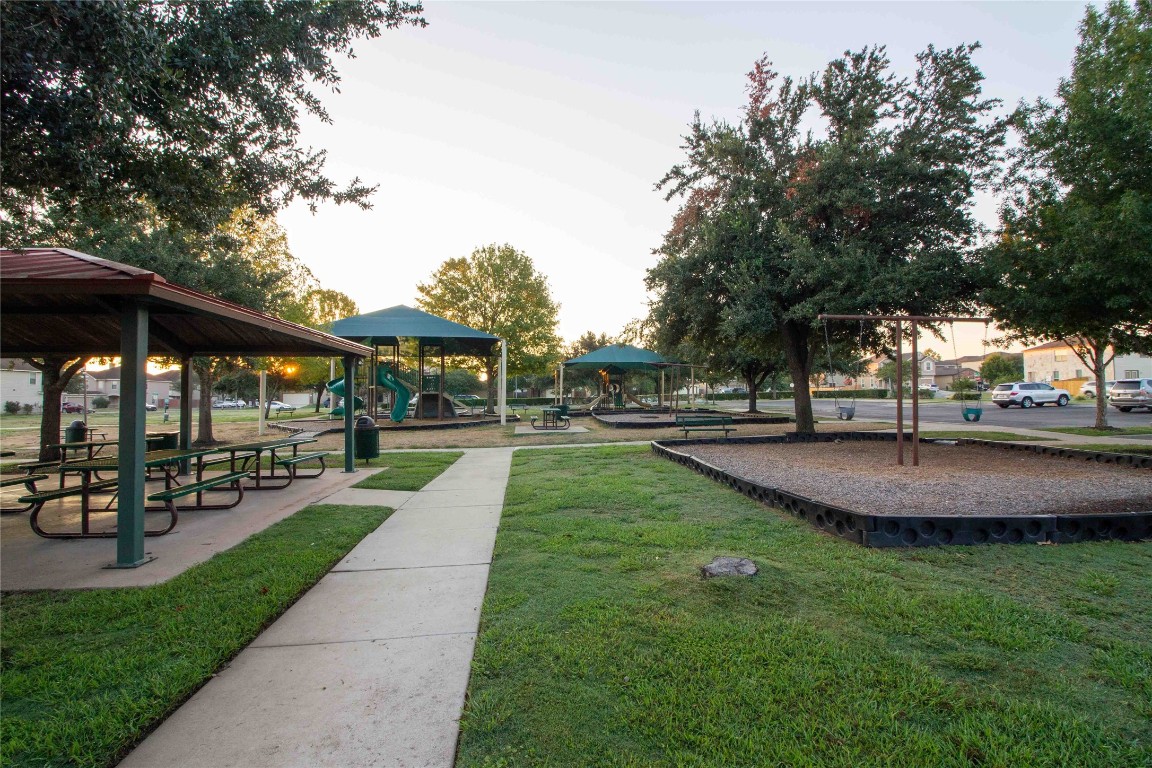 8609 Claude Court Austin, TX 78747 - Photo 27 of 30 a view of outdoor space with garden and trees