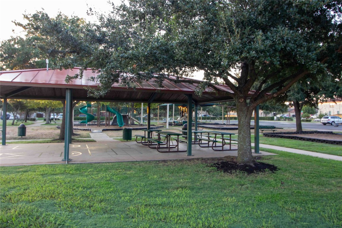 8609 Claude Court Austin, TX 78747 - Photo 28 of 30 a view of a table and chairs under an umbrella