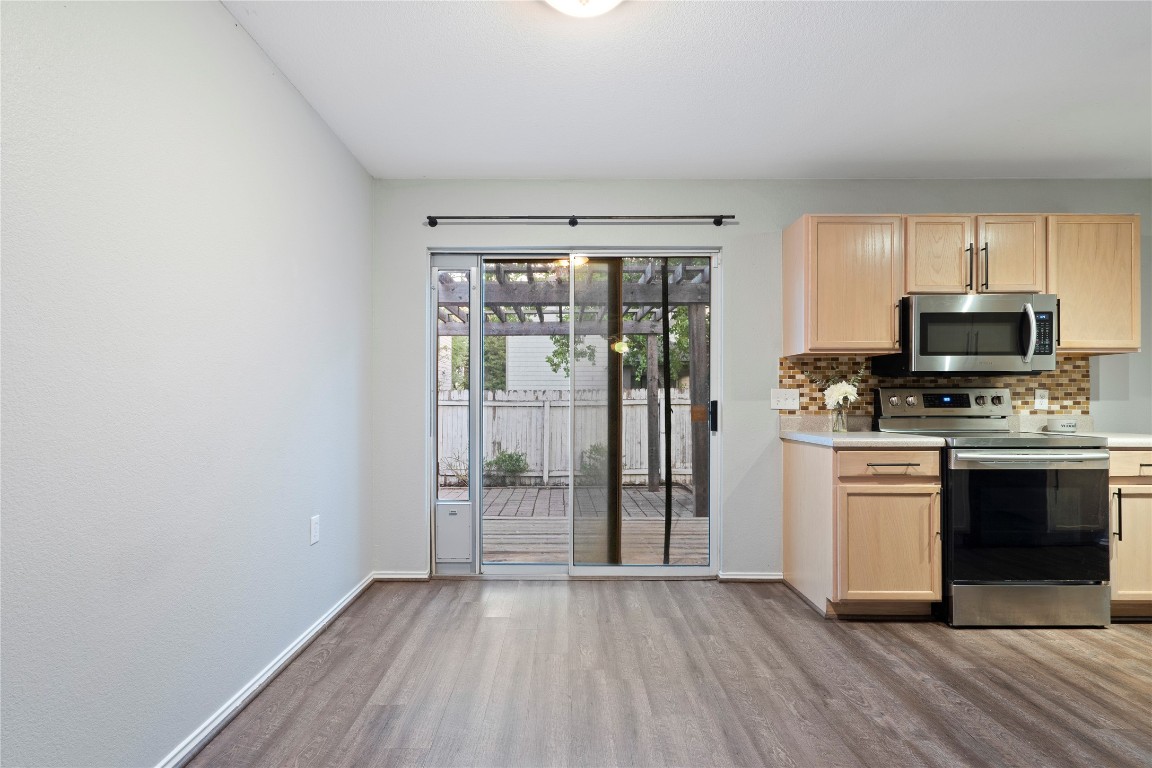 8609 Claude Court Austin, TX 78747 - Photo 5 of 30 a view of kitchen with sink refrigerator and window