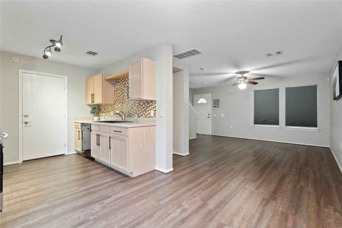 8609 Claude Court Austin, TX 78747 - Photo 6 of 30 a view of a kitchen with a sink and cabinet area