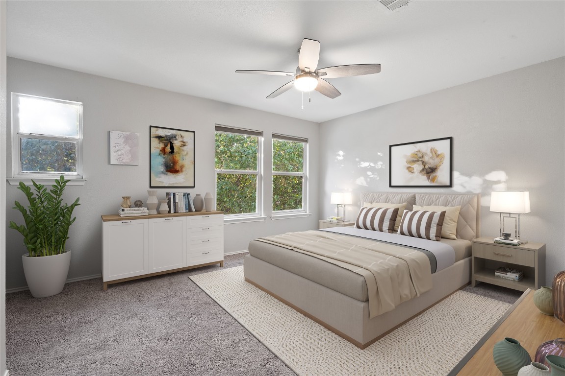 8609 Claude Court Austin, TX 78747 - Photo 8 of 30 a spacious bedroom with a large bed and a chandelier