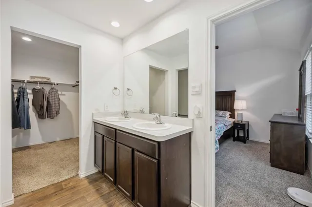 a kitchen with a sink and a refrigerator