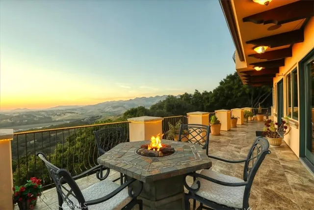 a terrace with a table and chairs
