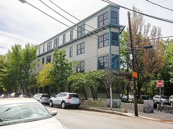 a cars parked in front of a building
