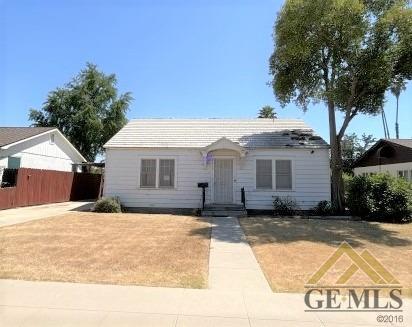 Undisclosed Address Wasco, CA 93280 - Photo 2 of 17 a front view of a house with a yard