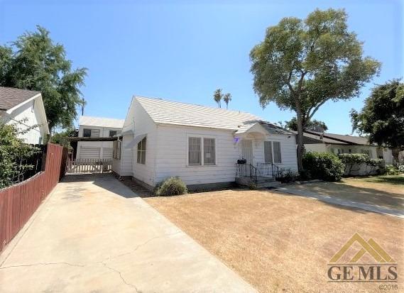 Undisclosed Address Wasco, CA 93280 - Photo 3 of 17 a front view of a house with a yard