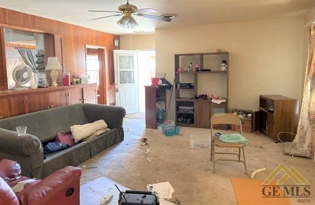 Undisclosed Address Wasco, CA 93280 - Photo 7 of 17 a living room with furniture and a chandelier