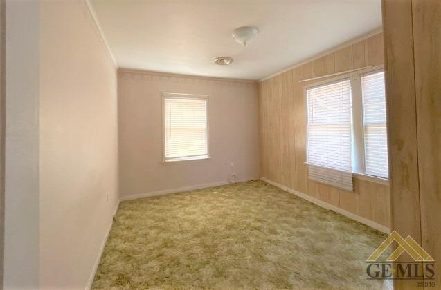 Undisclosed Address Wasco, CA 93280 - Photo 8 of 17 a view of an empty room with a window