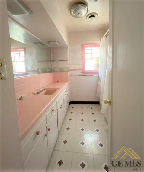 Undisclosed Address Wasco, CA 93280 - Photo 9 of 17 a bathroom with a sink and a mirror