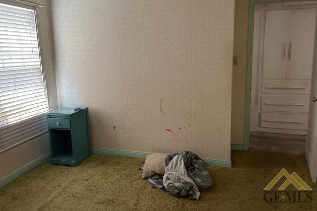Undisclosed Address Wasco, CA 93280 - Photo 10 of 17 a room with a bed and a window