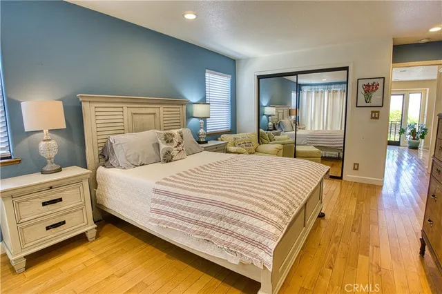 a bedroom with a bed and a night stand