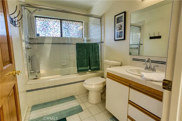 a view of a bathroom from a corridor