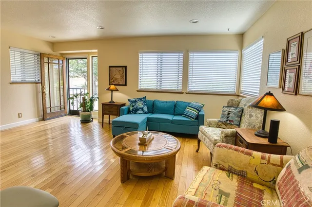 a living room with furniture and lamp
