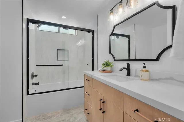 a bathroom with a double vanity sink mirror and double
