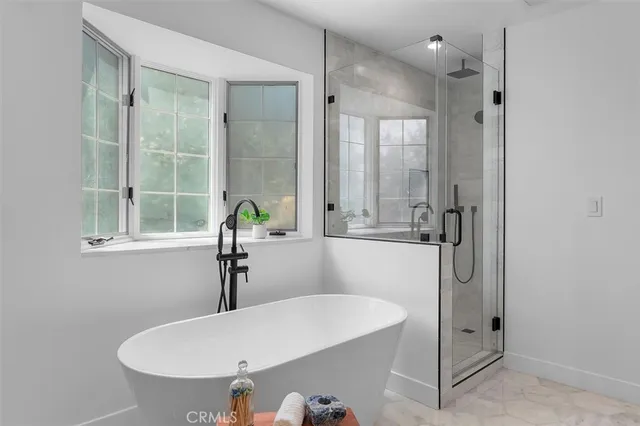 a bathroom with a sink and shower