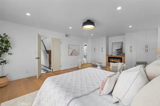 a bedroom with a bed and a couch