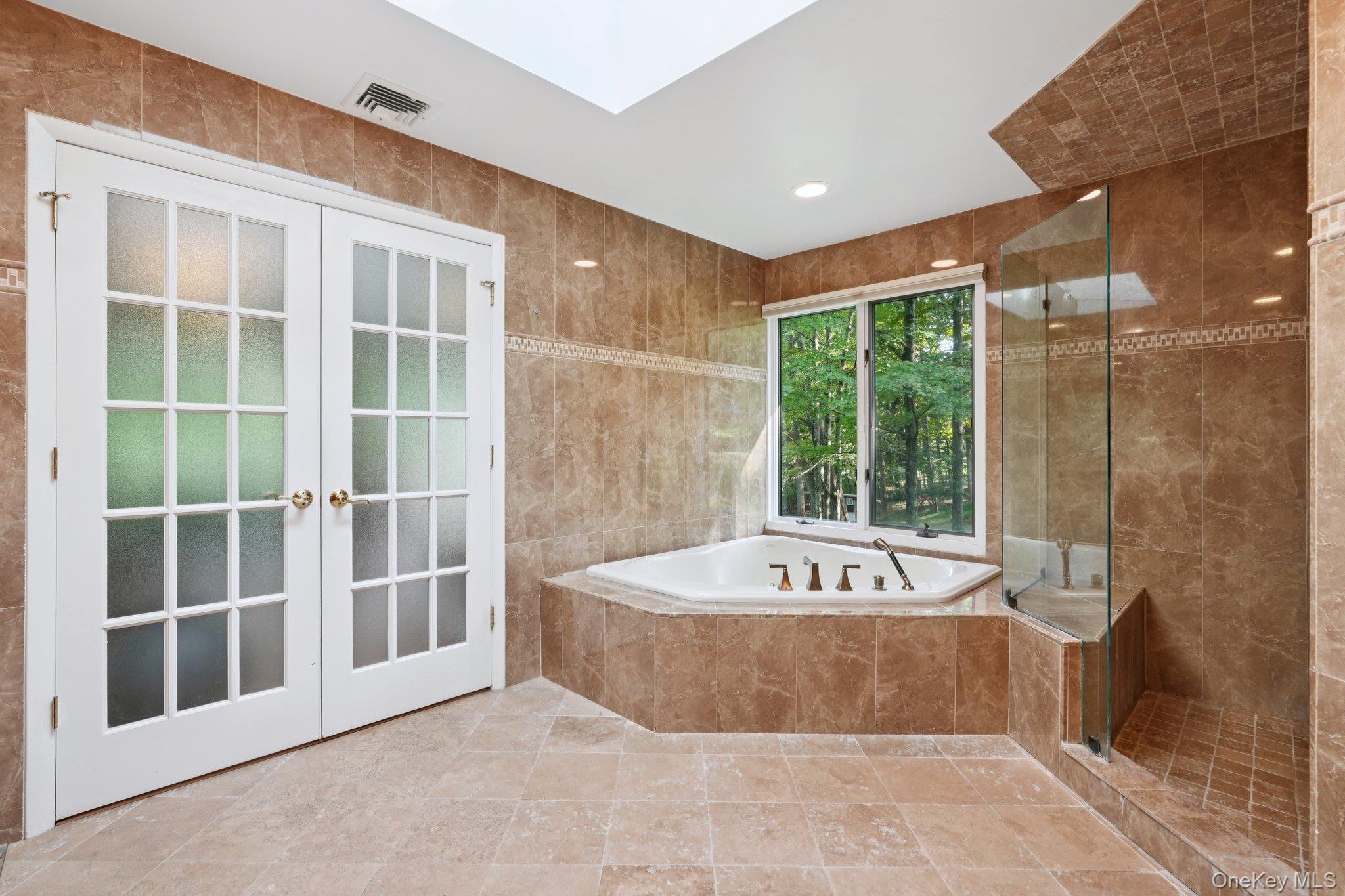 11 Old Phillips Hill Road New City, NY 10956 - Photo 18 of 42 a spacious bathroom with a tub and shower