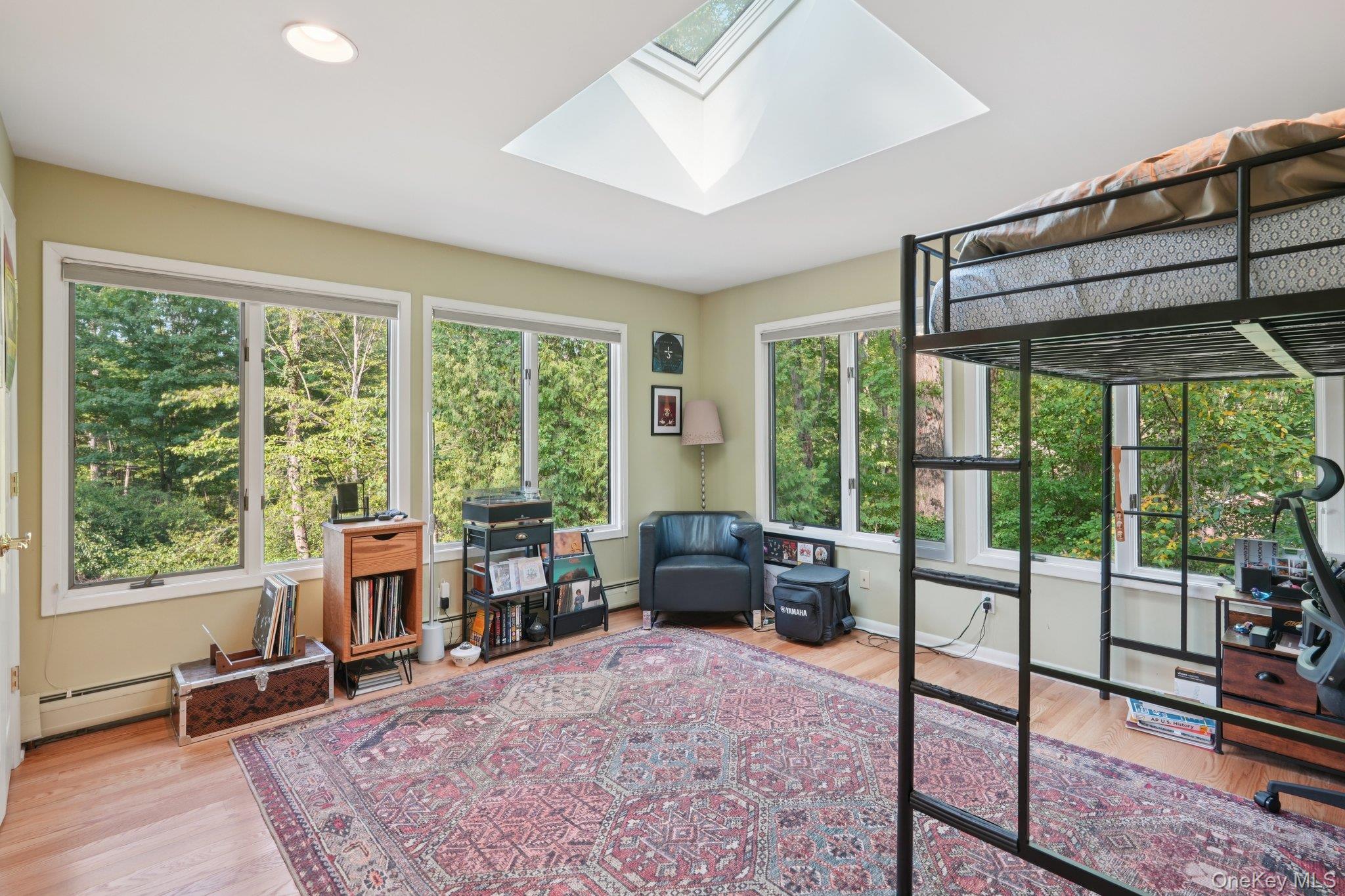 11 Old Phillips Hill Road New City, NY 10956 - Photo 21 of 42 a living room with furniture tv and large windows