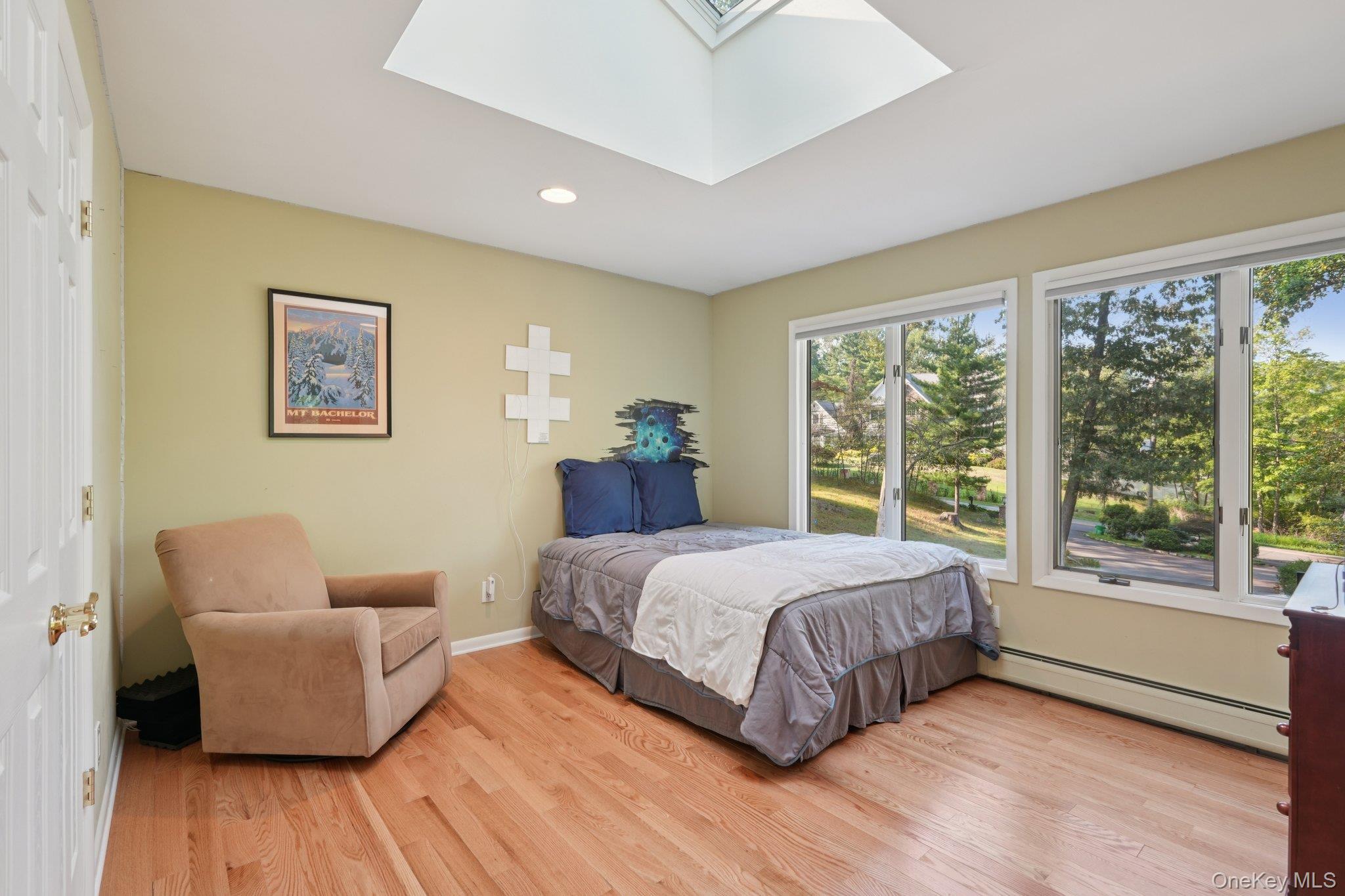11 Old Phillips Hill Road New City, NY 10956 - Photo 22 of 42 a bedroom with a bed and wooden floor