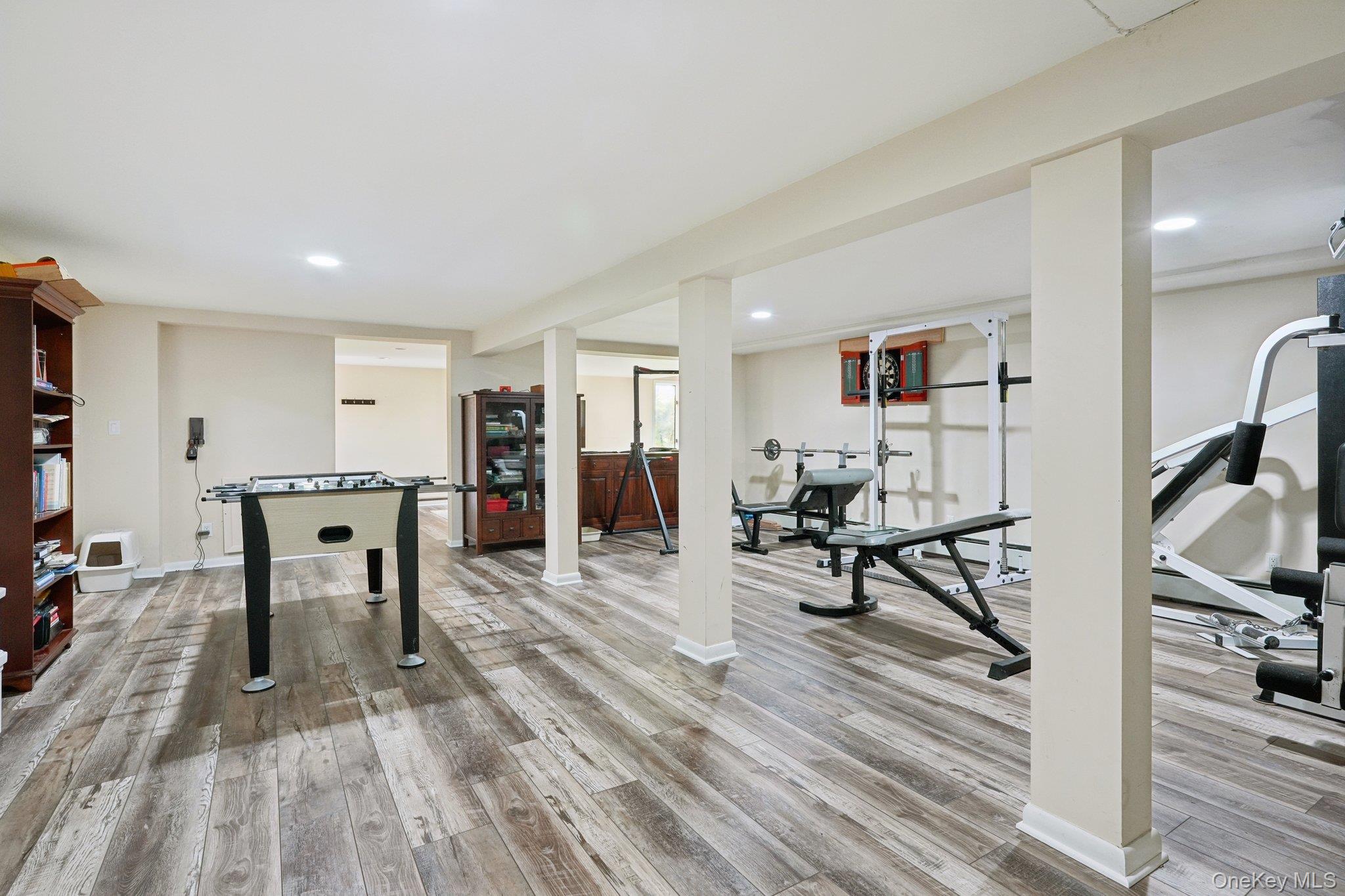 11 Old Phillips Hill Road New City, NY 10956 - Photo 28 of 42 a living room with furniture a flat screen tv and a wooden floor