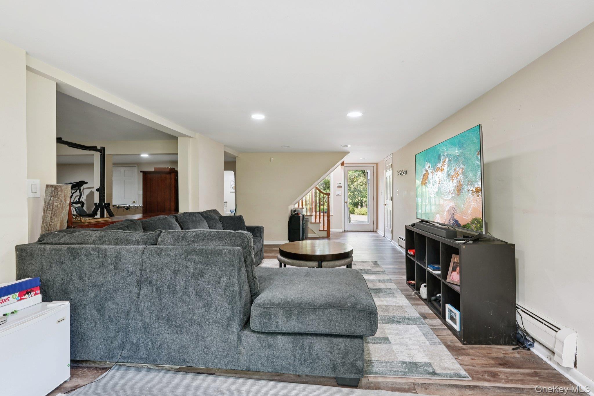 11 Old Phillips Hill Road New City, NY 10956 - Photo 30 of 42 a living room with furniture and a flat screen tv