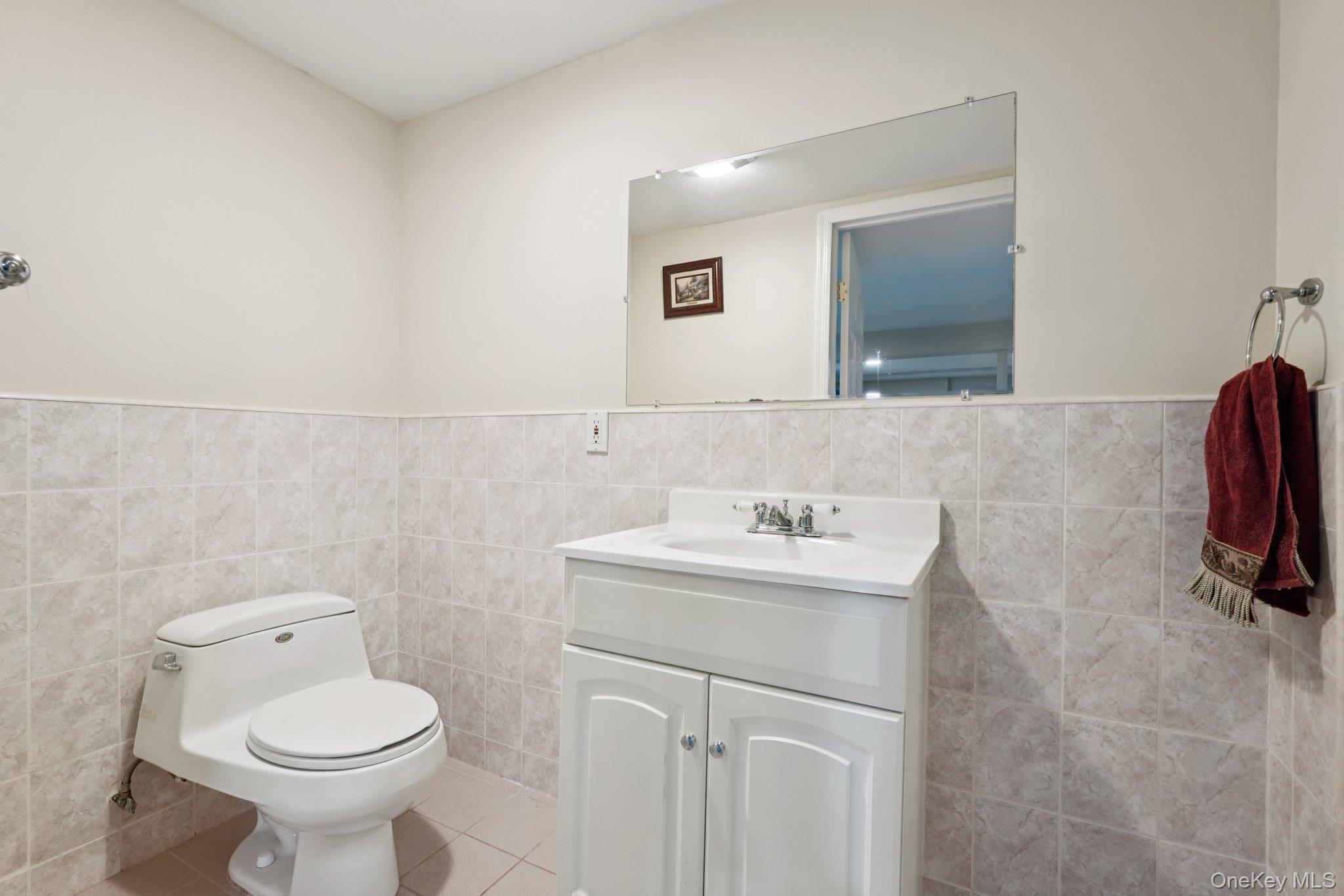 11 Old Phillips Hill Road New City, NY 10956 - Photo 31 of 42 a bathroom with a toilet sink and mirror