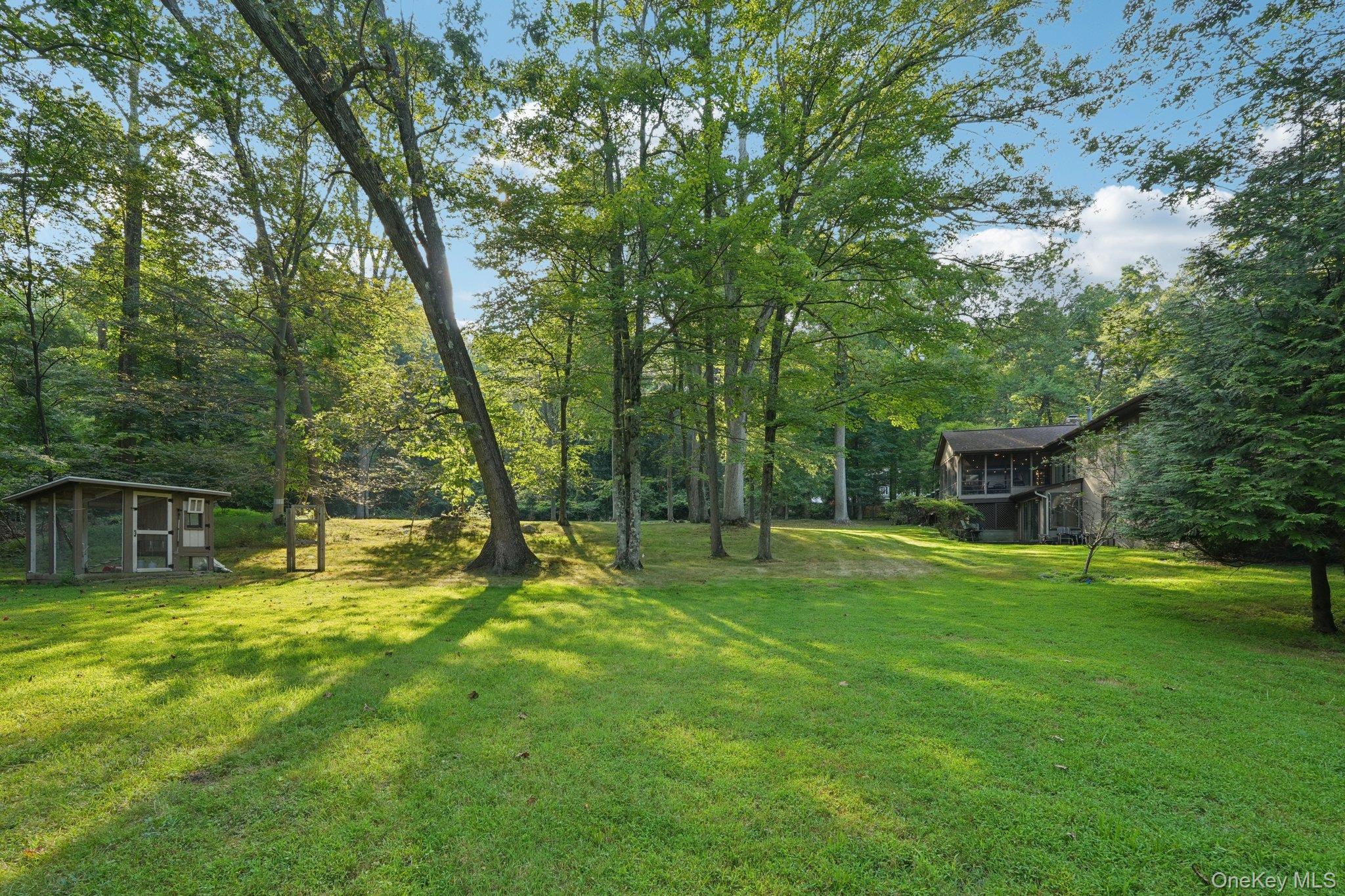 11 Old Phillips Hill Road New City, NY 10956 - Photo 36 of 42 a backyard of a house with table and chairs