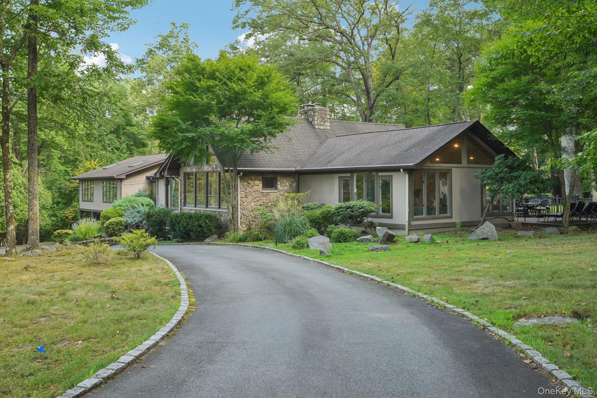 11 Old Phillips Hill Road New City, NY 10956 - Photo 40 of 42 a front view of a house with a yard