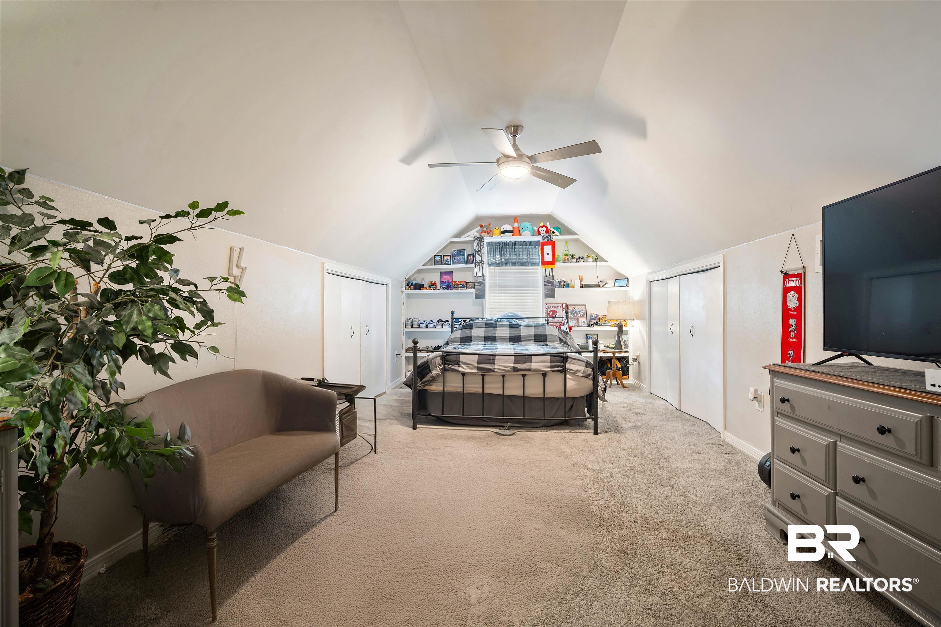 110 Lakeview Loop Daphne, AL 36526 - Photo 25 of 40 Carpeted bedroom featuring ceiling fan, baseboards, and lofted ceiling