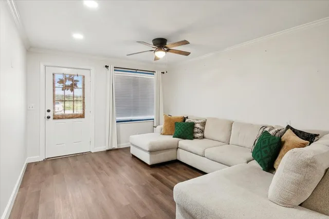 a living room with couches a lamp and a coffee table