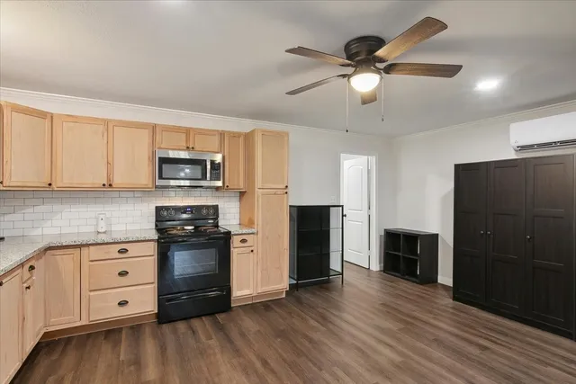 a kitchen with stainless steel appliances a refrigerator sink and cabinets