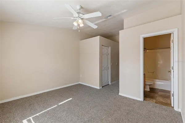 an empty room with a bathroom