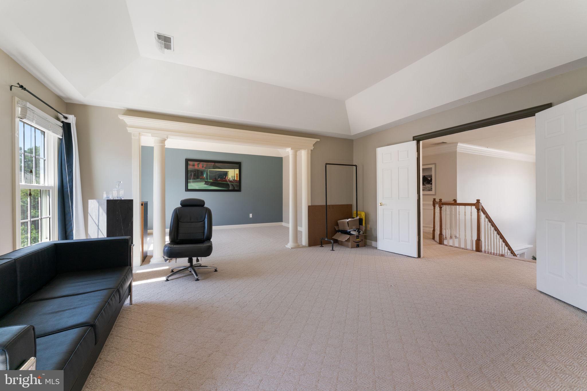2113 Arrowleaf Drive Vienna, VA 22182 - Photo 16 of 40 a view of a livingroom with workspace and a window