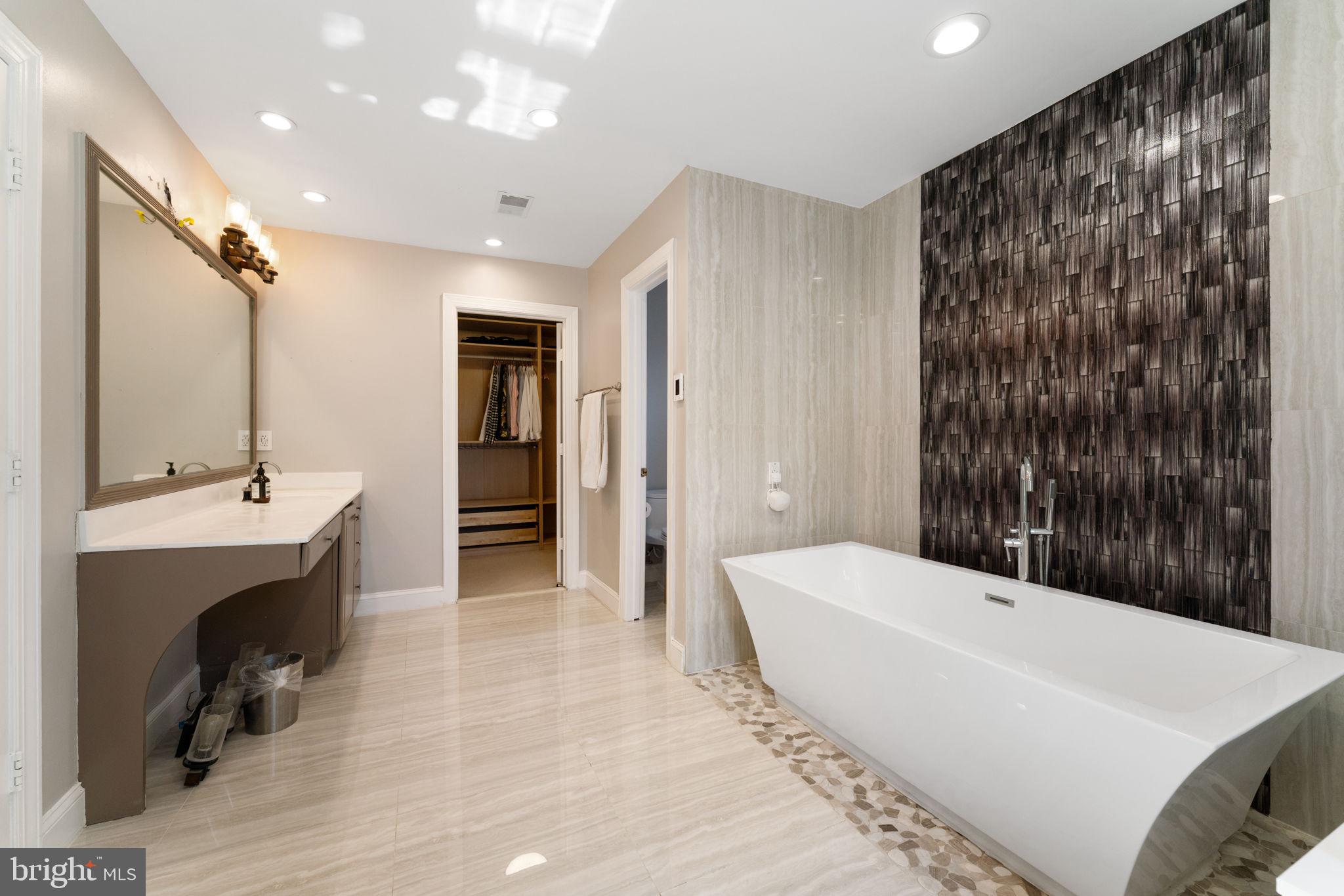 2113 Arrowleaf Drive Vienna, VA 22182 - Photo 19 of 40 a bathroom with a bathtub and a sink