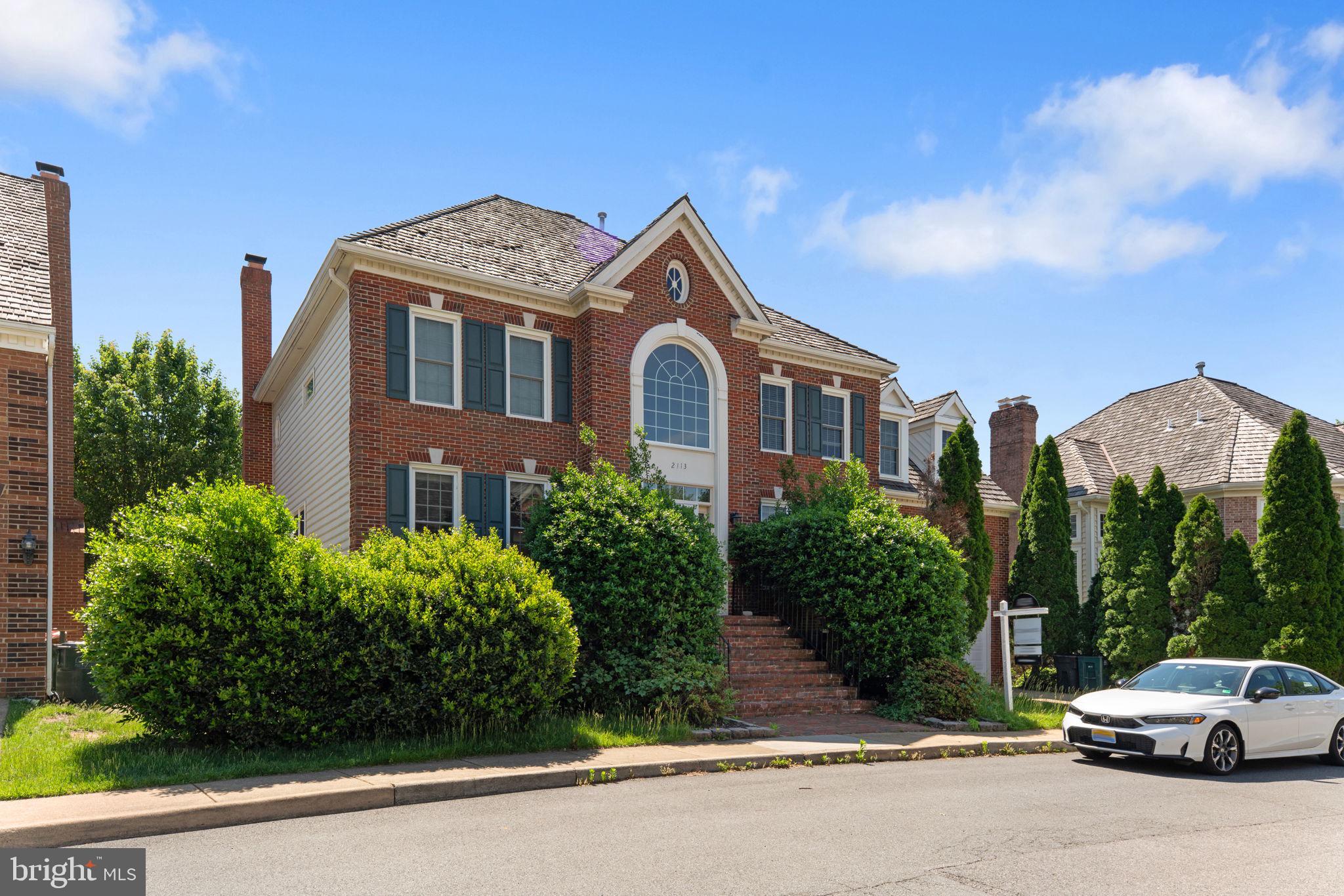 2113 Arrowleaf Drive Vienna, VA 22182 - Photo 2 of 40 a front view of a house with a yard