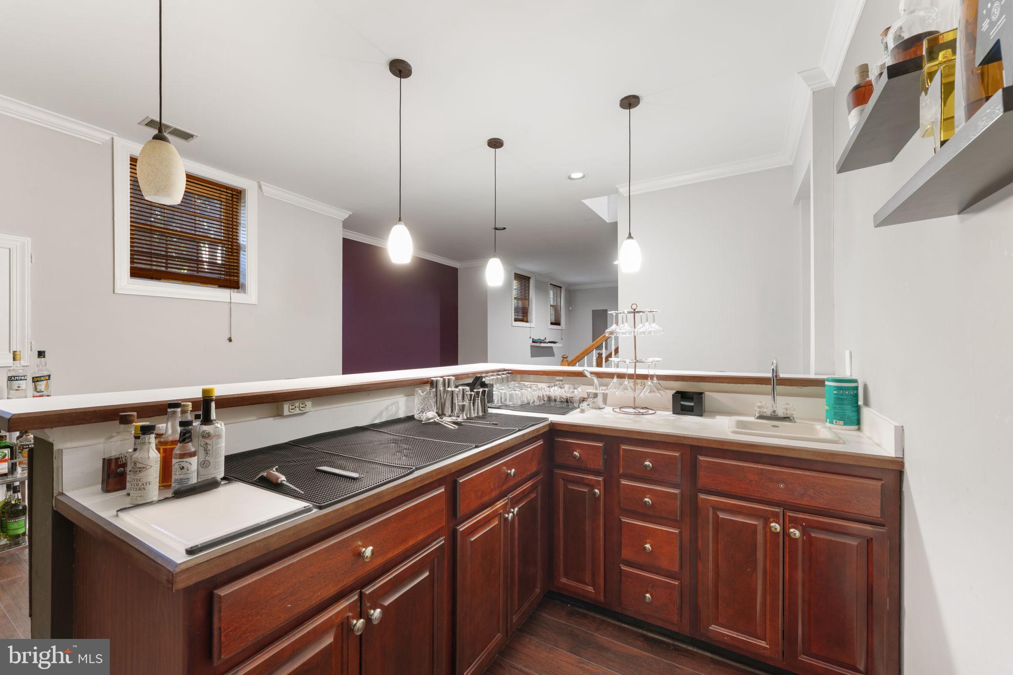 2113 Arrowleaf Drive Vienna, VA 22182 - Photo 29 of 40 a kitchen with a sink stove and cabinets