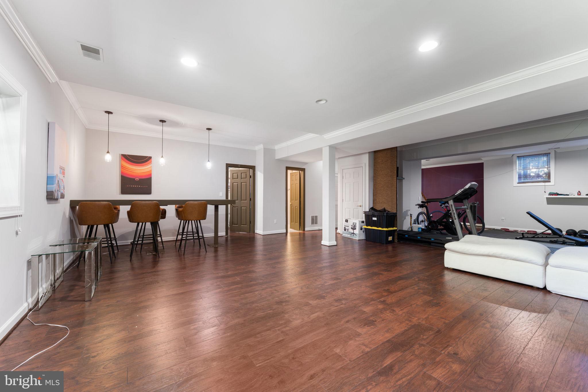 2113 Arrowleaf Drive Vienna, VA 22182 - Photo 30 of 40 a living room with furniture and a wooden floor