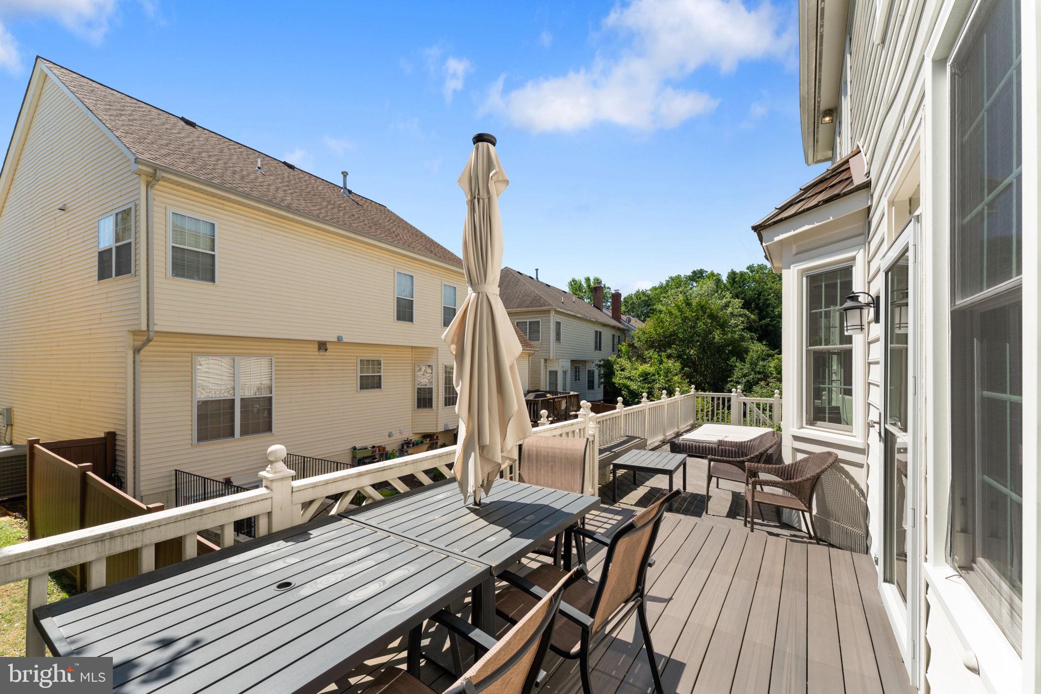 2113 Arrowleaf Drive Vienna, VA 22182 - Photo 36 of 40 a view of a balcony with chairs and wooden floor