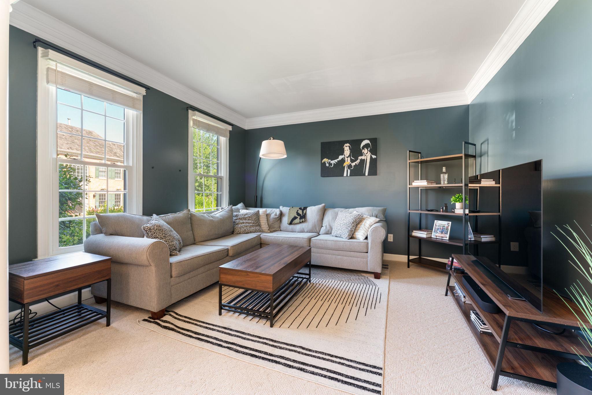 2113 Arrowleaf Drive Vienna, VA 22182 - Photo 6 of 40 a living room with furniture and a flat screen tv