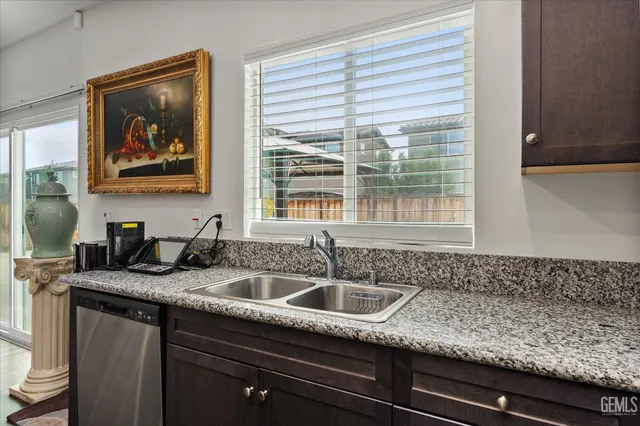 a kitchen with sink and window