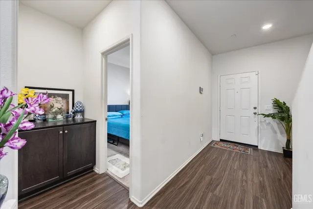a view of a hallway view with wooden floor and staircase