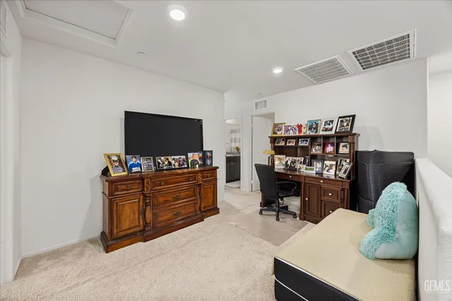 a room with furniture and flat screen tv