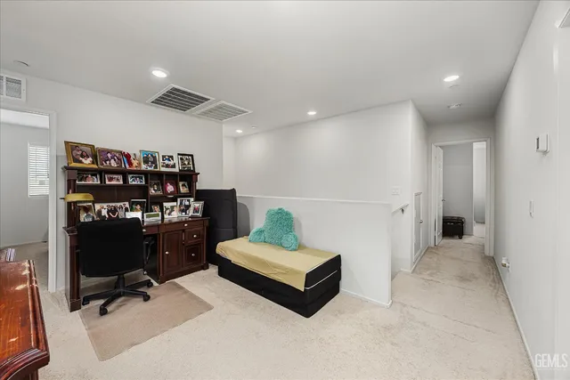 a living room with furniture and gym equipment