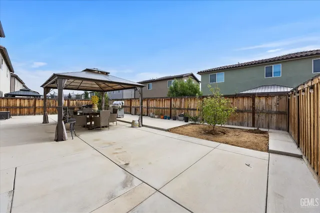 a view of living room with furniture and a large window