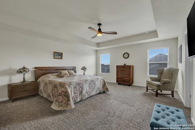 a spacious bathroom with a double vanity sink a mirror and a shower