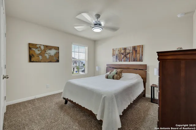 a view of a workspace with furniture and a bookshelf