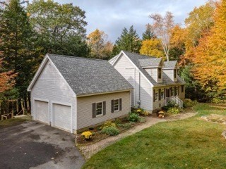 51 Tracey Cove Circle Rome, ME 04963 - Photo 1 of 25 a view of house with yard and trees in the background