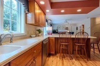 51 Tracey Cove Circle Rome, ME 04963 - Photo 12 of 25 a kitchen with stainless steel appliances granite countertop a sink table and chairs